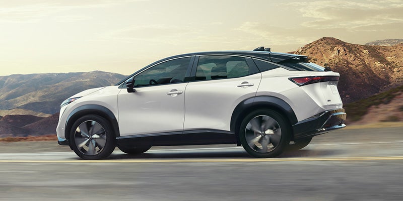 White Ariya running on the road