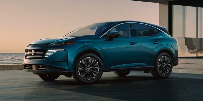 Green Murano car parked front of building front and left view